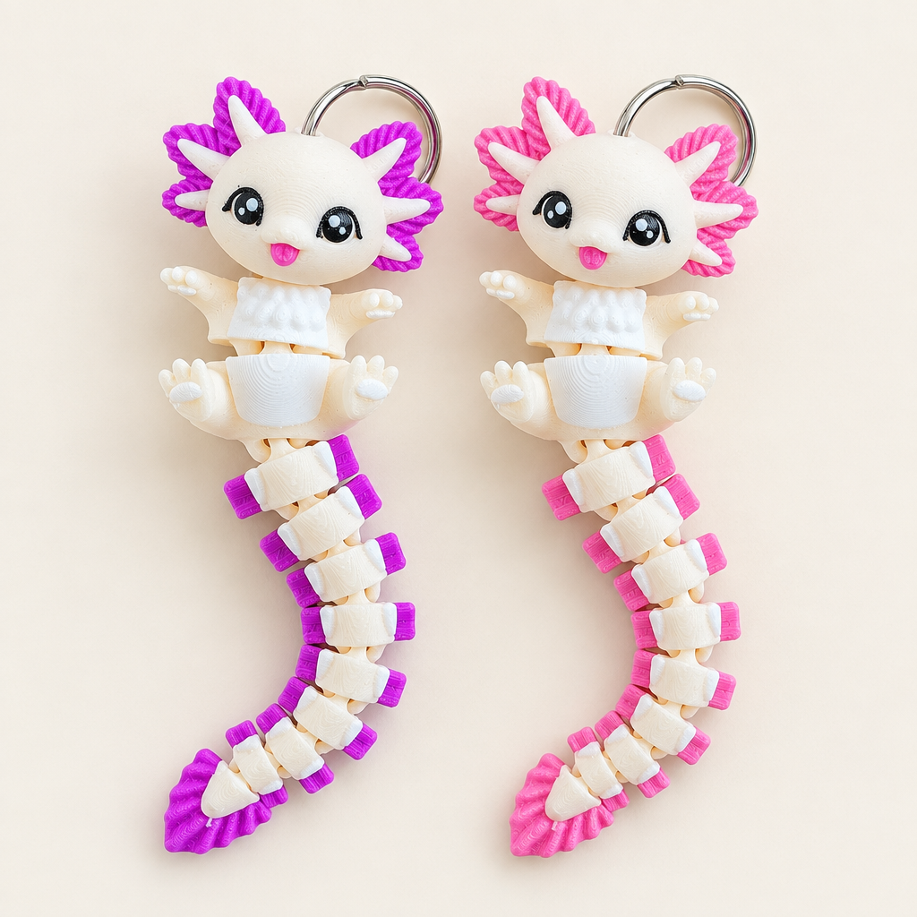 Coverfoto met de wit-paarse en wit-roze axolotl-sleutelhangers