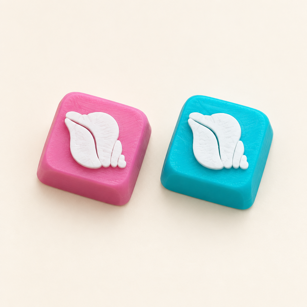 Coverfoto met roze en blauwe schelp-keycap