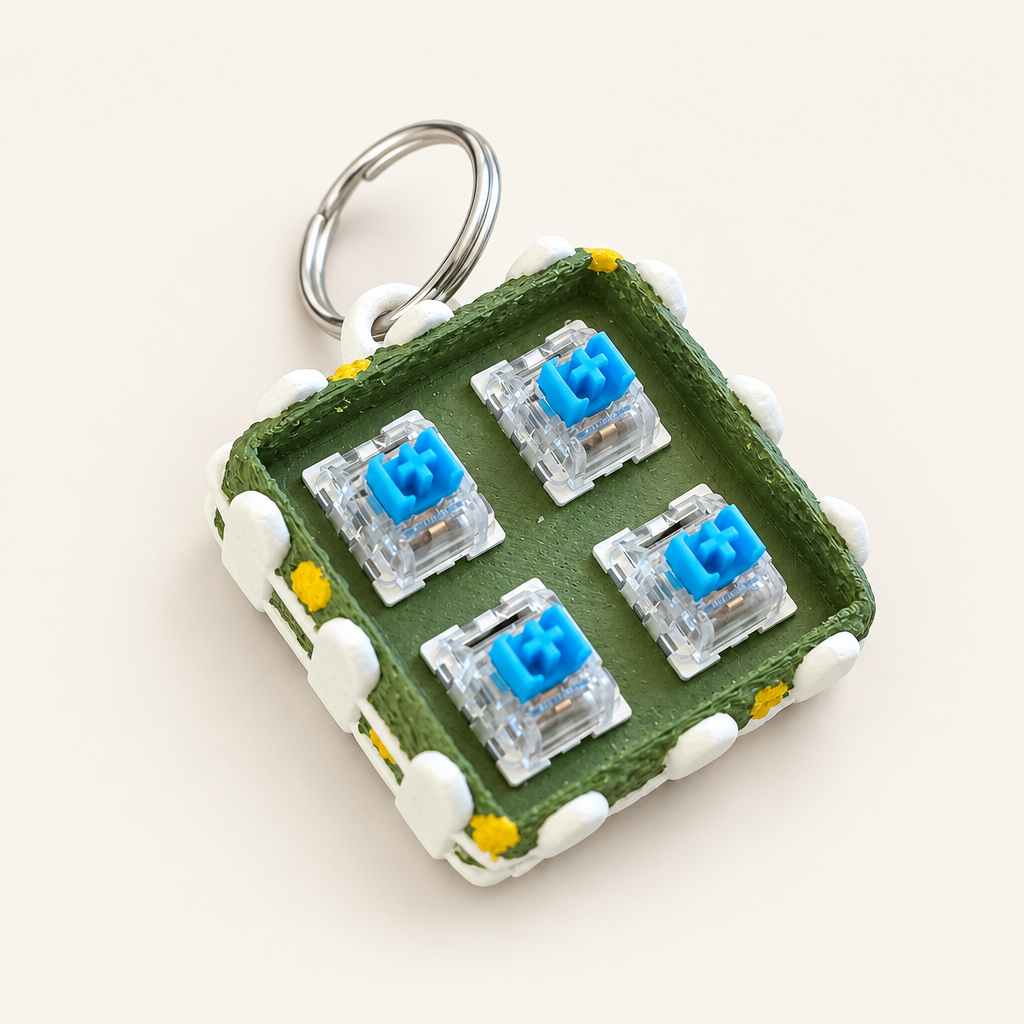 Grasveld clicker base met vier vakjes en sleutelhanger