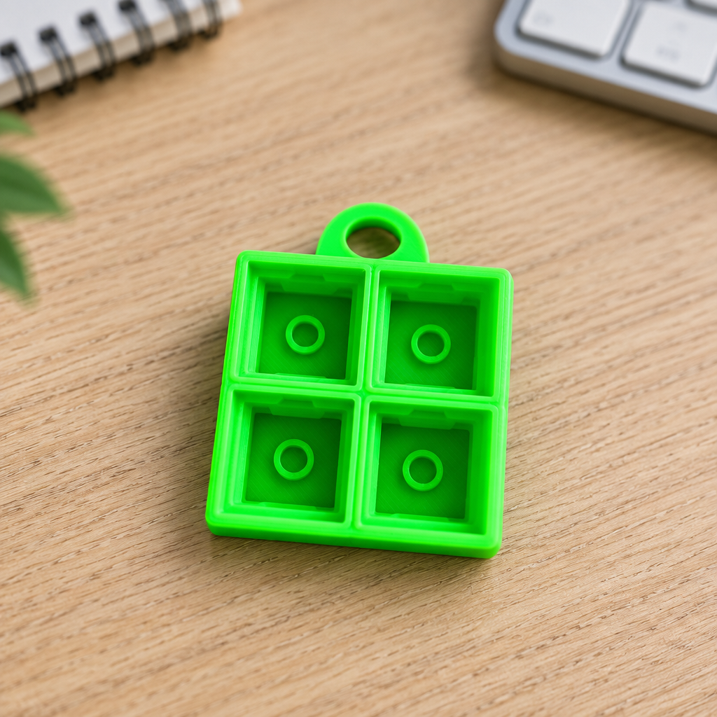 Neongroene clicker-base op een bureau
