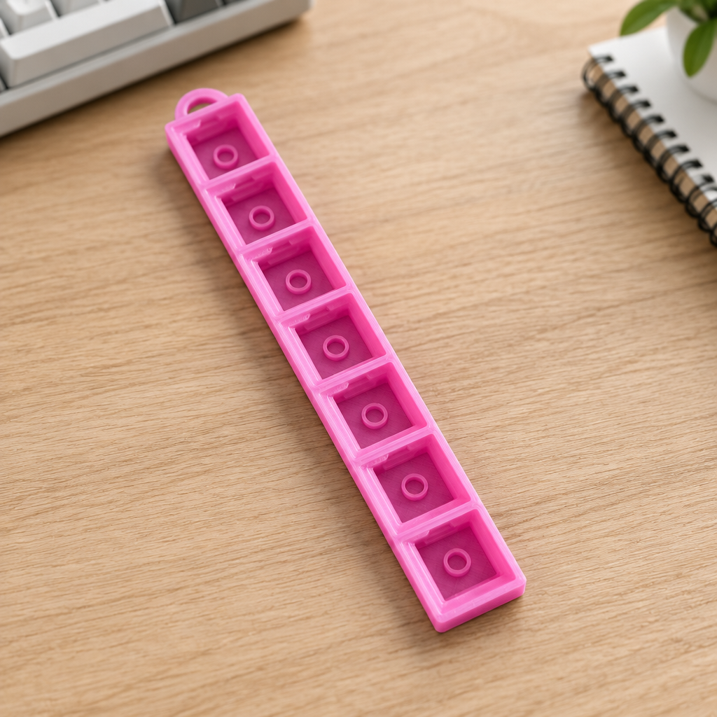Roze clicker op een bureau