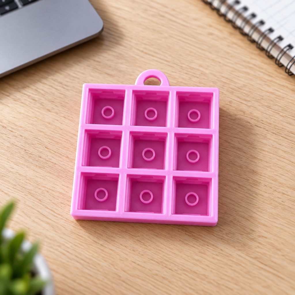 Roze clickerbasis op een bureau
